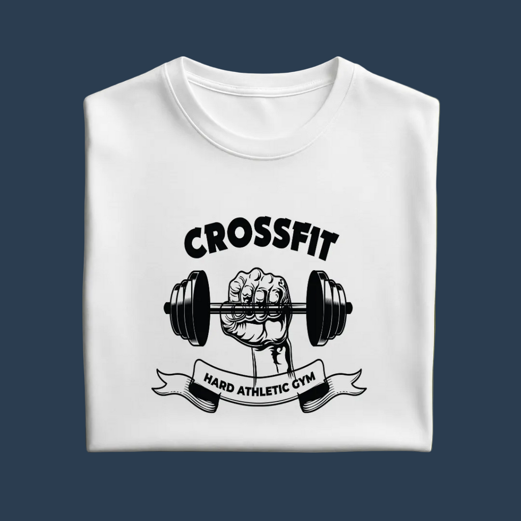 A folded white crewneck t-shirt with a black graphic print of a hand gripping a barbell under the word 'CROSSFIT' and above a banner reading 'HARD ATHLETIC GYM', displayed on a solid olive green background.